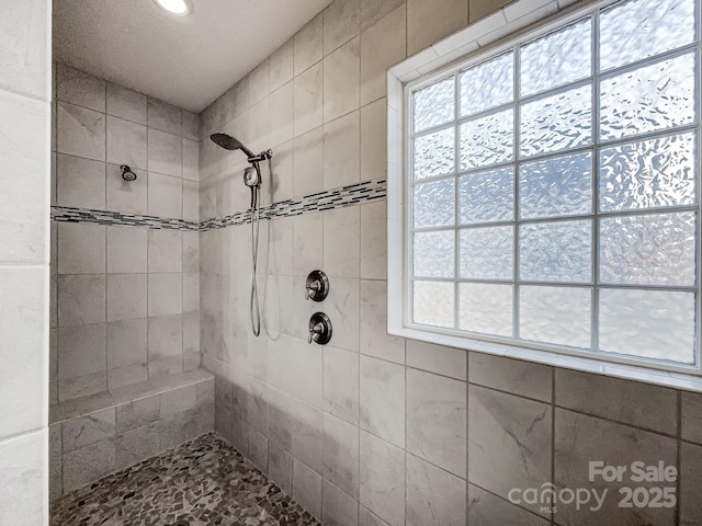 bathroom featuring tiled shower