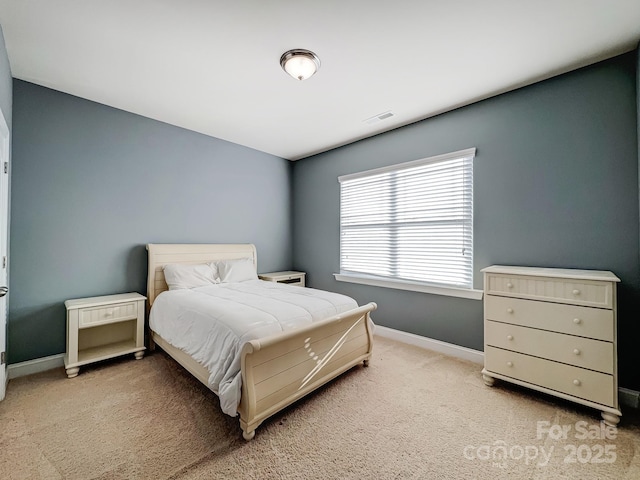 bedroom featuring light carpet