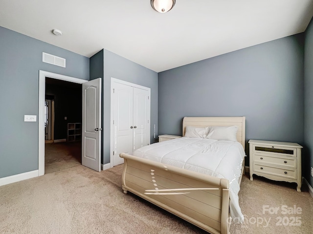 carpeted bedroom with a closet