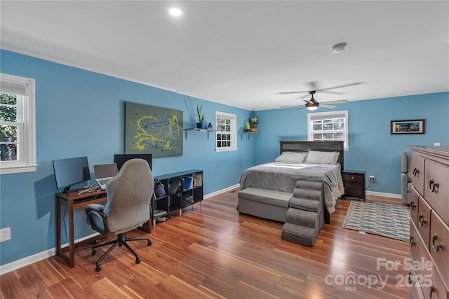 bedroom featuring ceiling fan and hardwood / wood-style floors