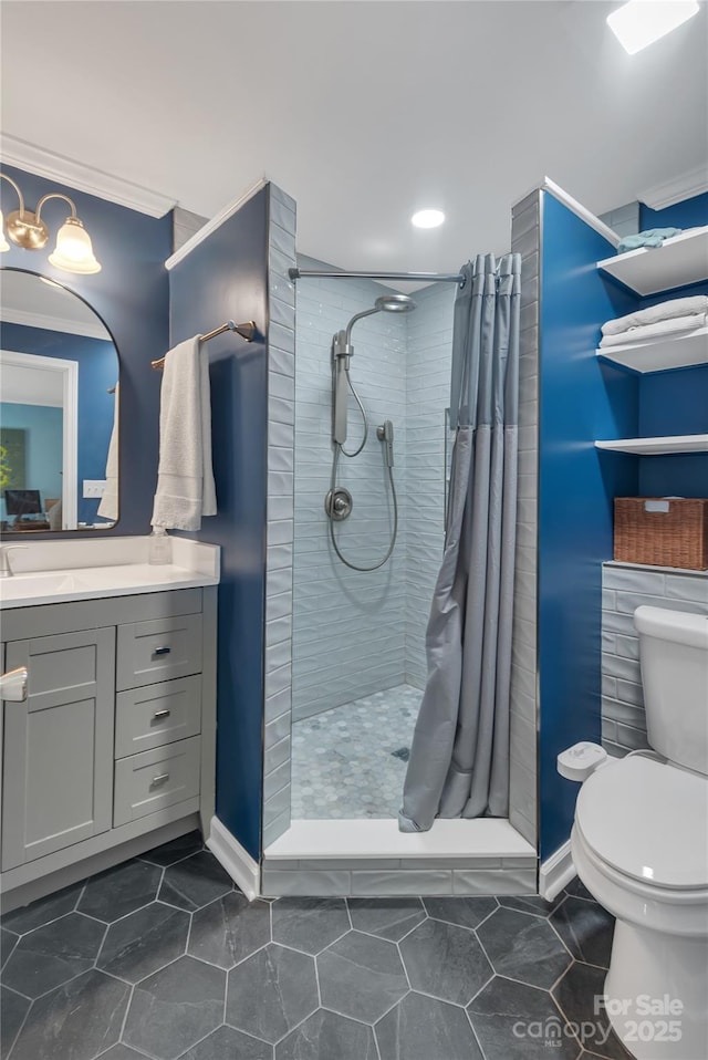 bathroom with toilet, vanity, and a shower with curtain