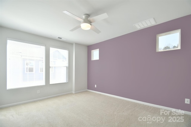 carpeted empty room with ceiling fan