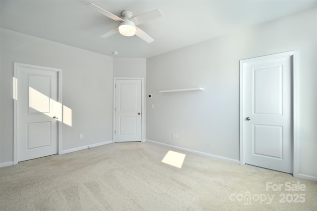 unfurnished bedroom with light carpet and ceiling fan