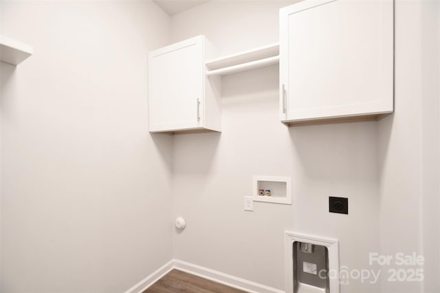 laundry area with cabinets, hookup for an electric dryer, dark hardwood / wood-style floors, and washer hookup