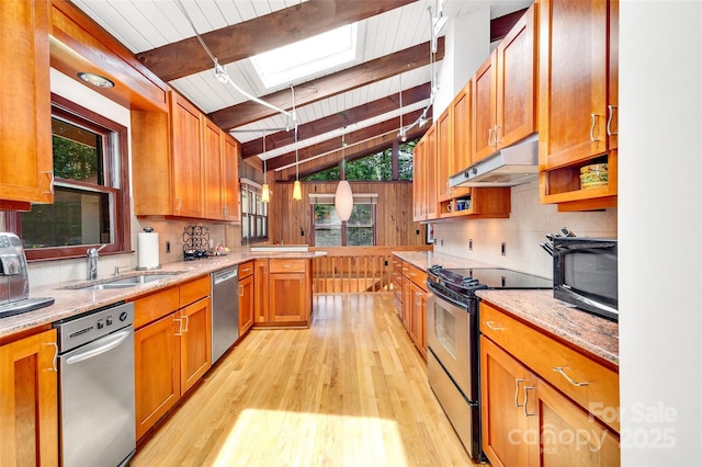 kitchen with sink, appliances with stainless steel finishes, vaulted ceiling with skylight, light hardwood / wood-style floors, and wooden ceiling