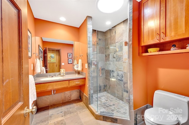 bathroom featuring sink, toilet, and walk in shower