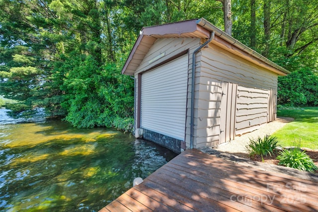 view of outbuilding with a water view