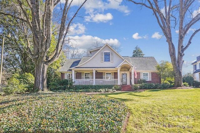 view of front of property with a front yard and a porch