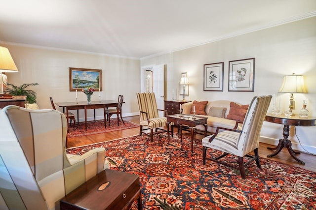 living room featuring hardwood / wood-style flooring and crown molding