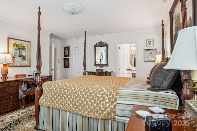 bedroom featuring ensuite bath, crown molding, and built in desk