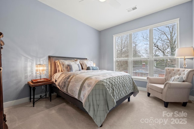 bedroom featuring light carpet and ceiling fan