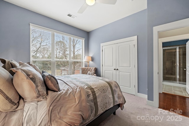 bedroom with ceiling fan, a closet, and carpet flooring