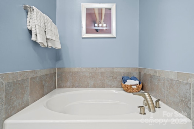 bathroom featuring a washtub