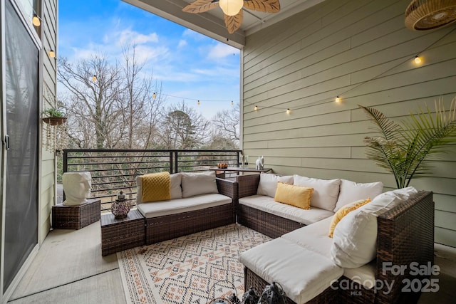 exterior space with ceiling fan and an outdoor living space