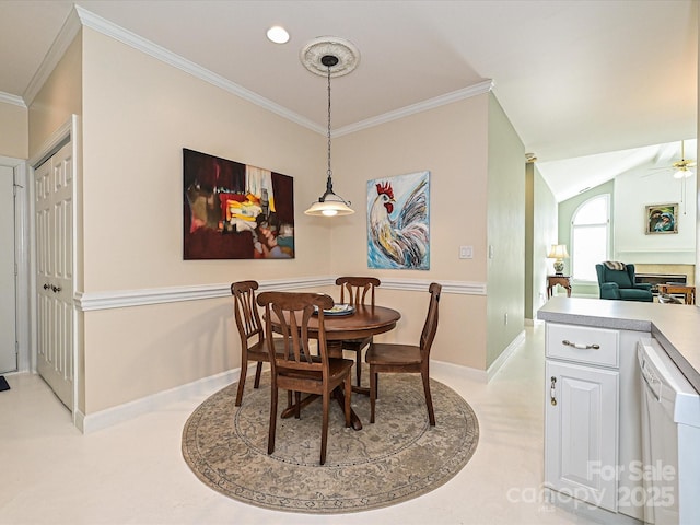 dining space with lofted ceiling, ceiling fan, and ornamental molding