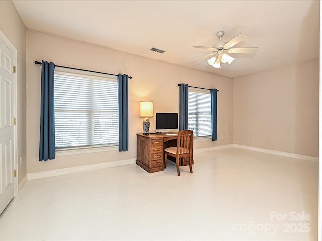 home office with ceiling fan and a wealth of natural light