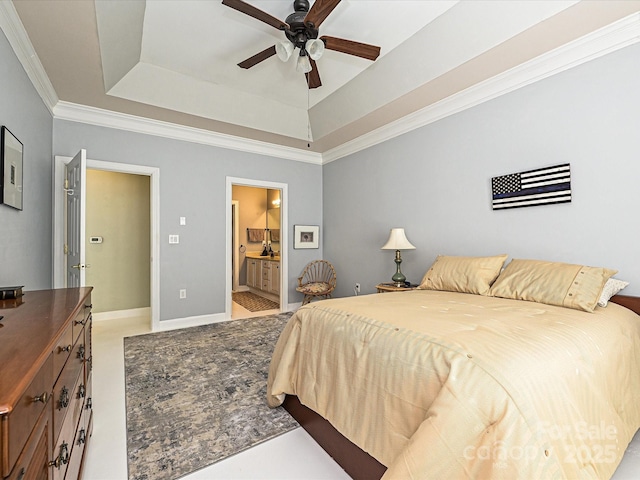 bedroom with ceiling fan, ensuite bathroom, crown molding, and a raised ceiling