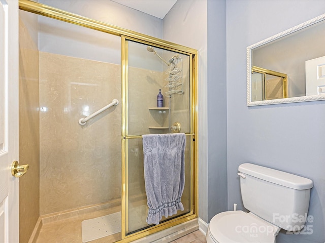 bathroom with toilet, tile patterned flooring, and walk in shower