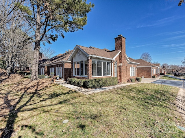 view of home's exterior with a yard