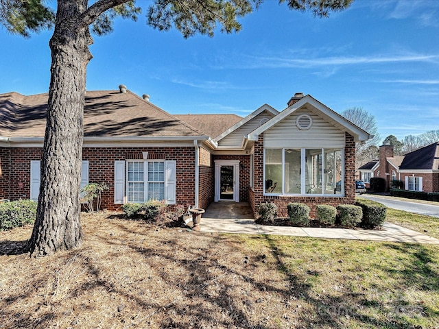 ranch-style home with a front yard