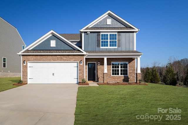 craftsman house with a garage and a front lawn