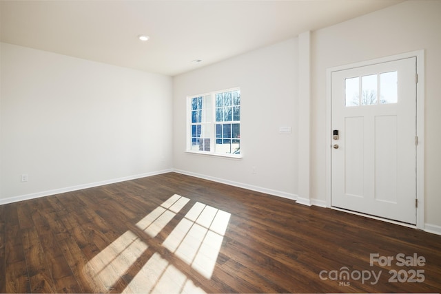 foyer featuring dark wood-type flooring