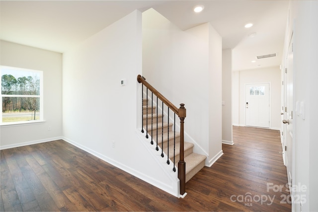 stairs with wood-type flooring