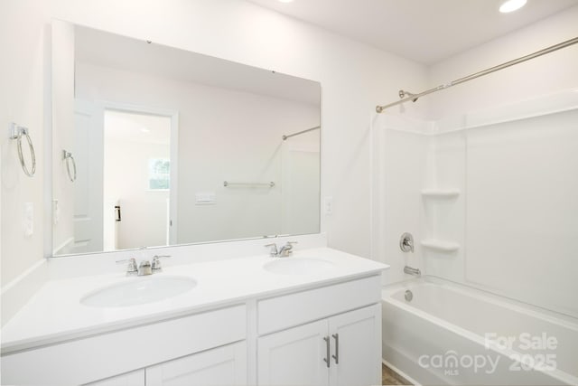 bathroom featuring vanity and shower / tub combination