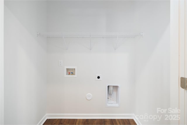 clothes washing area featuring hookup for a washing machine, electric dryer hookup, dark hardwood / wood-style flooring, and gas dryer hookup