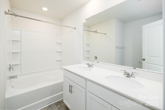 bathroom featuring vanity and bathing tub / shower combination