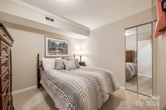 bedroom featuring a closet, light carpet, and ornamental molding