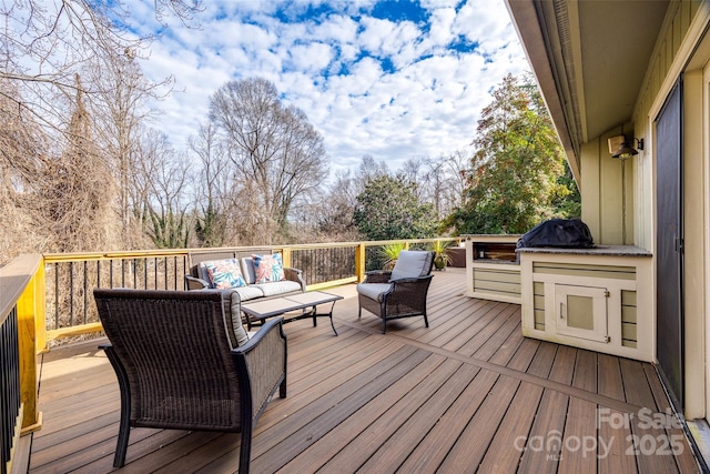 wooden deck featuring an outdoor living space