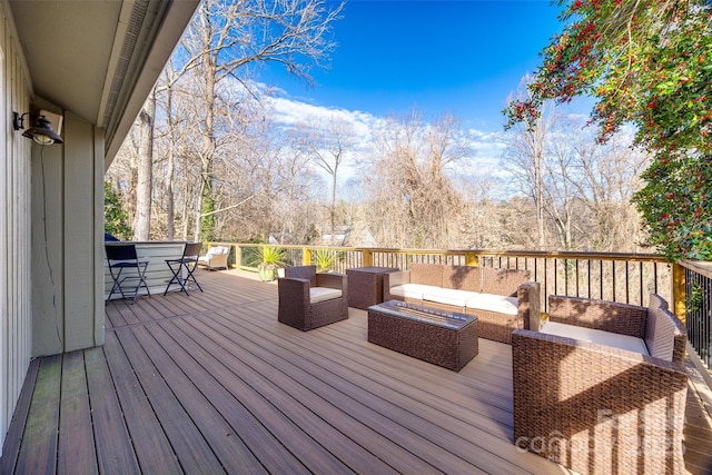 wooden terrace featuring an outdoor living space