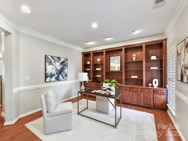 office space featuring ornamental molding and hardwood / wood-style floors