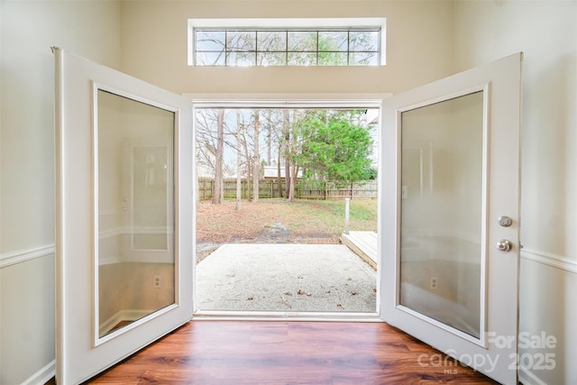 entryway with wood finished floors