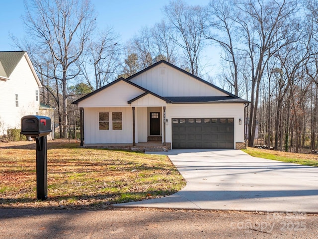 view of front of house with a front yard and a garage