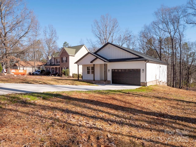 view of front facade with a front yard and a garage