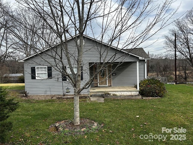 rear view of house with a lawn