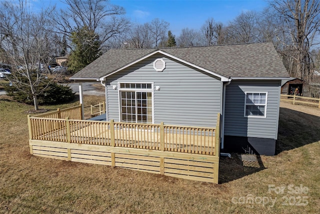 exterior space featuring a yard and a deck