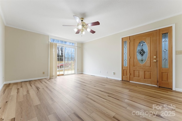 entryway featuring ornamental molding, ceiling fan, and light wood-type flooring