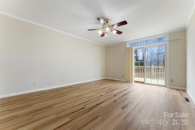 empty room with crown molding, ceiling fan, and light wood-type flooring