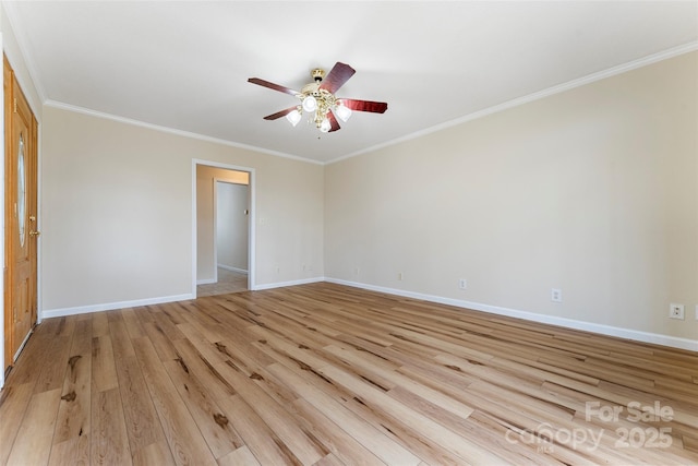 spare room featuring ceiling fan, ornamental molding, and light wood-type flooring