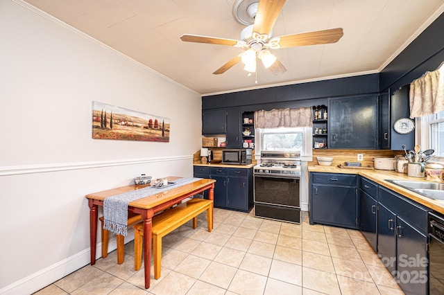 kitchen featuring light tile patterned flooring, ornamental molding, range with gas cooktop, and black dishwasher