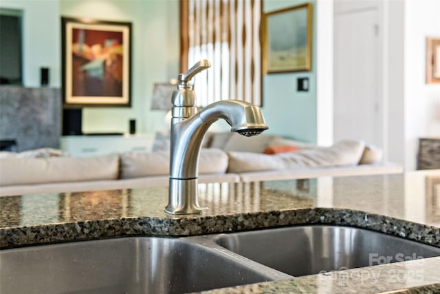 details with sink and dark stone countertops