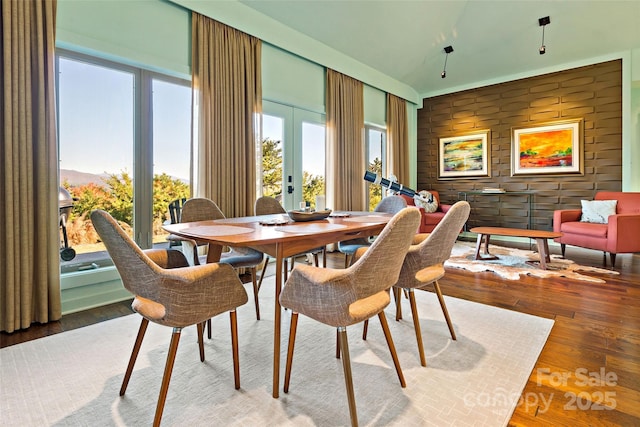 dining area featuring french doors and hardwood / wood-style flooring