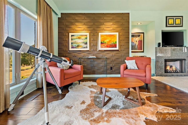 sitting room with dark wood-type flooring