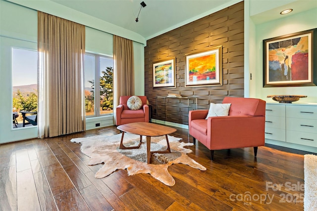 sitting room featuring dark wood-type flooring