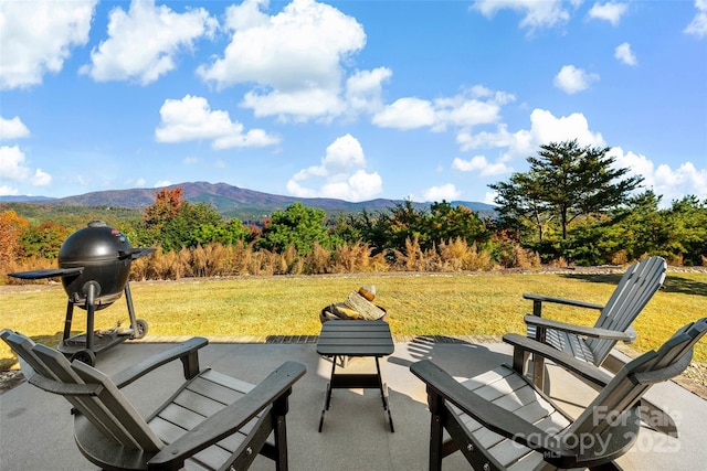 view of patio / terrace featuring a mountain view