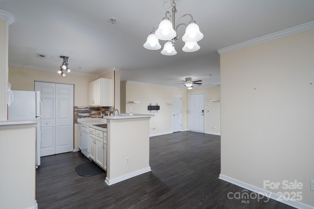 kitchen featuring pendant lighting, white appliances, ornamental molding, white cabinets, and kitchen peninsula