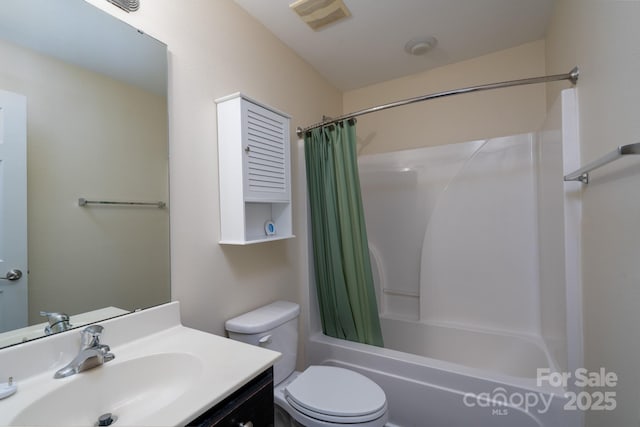 full bathroom with shower / tub combo, vanity, and toilet